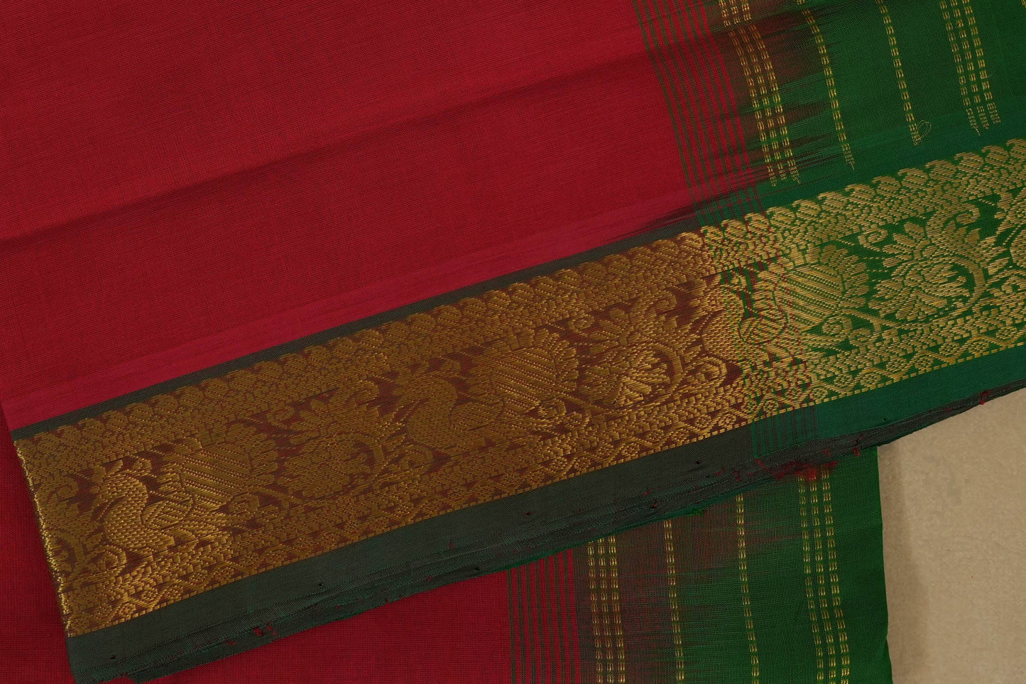 Red and green saree with a gold border, silk cotton , nine and a half yards saree close up