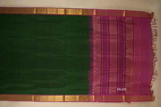 Green and purple saree with a gold border on a plain background with paloo, silk cotton , nine and a half yards saree
