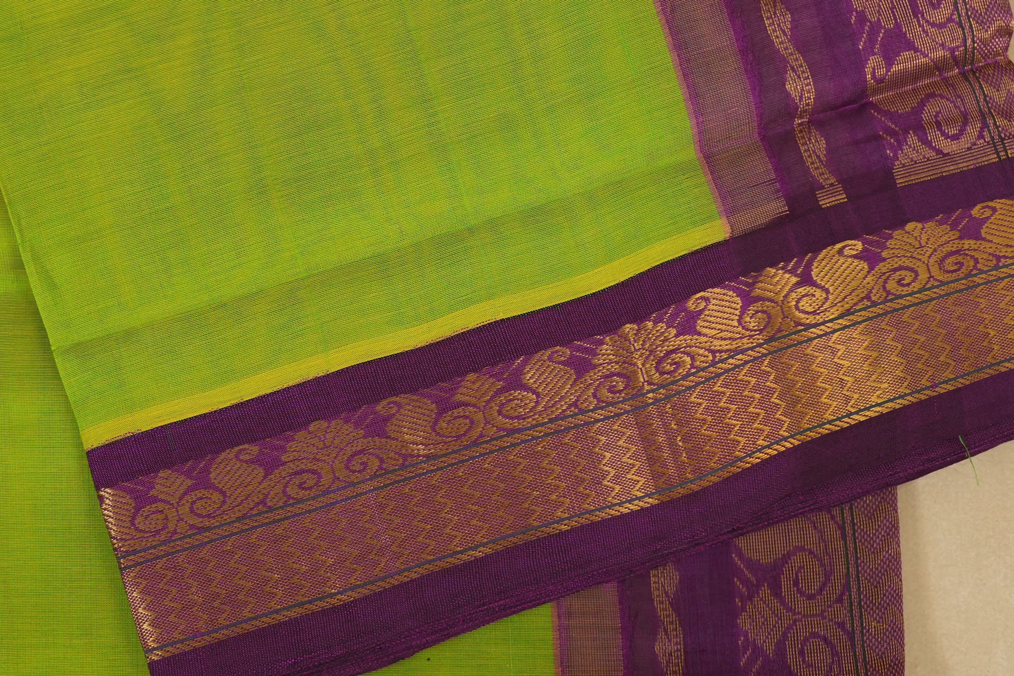 Green and purple saree with a decorative border, silk cotton , nine and a half yards saree