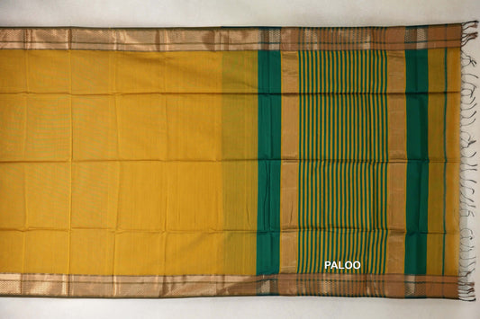 Spread-out Maheshwari silk cotton saree with a mustard yellow body, deep emerald green pallu with mustard stripes, patterned borders and tassels.