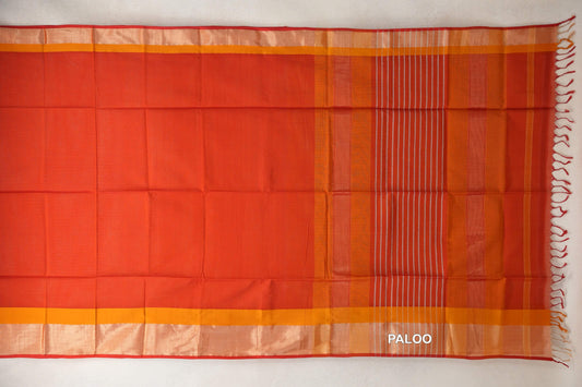 Tomato red Maheshwari silk cotton saree laid flat, with mustard orange borders, a striped pallu on the right and red tassels.