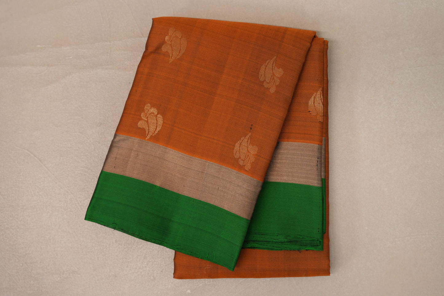 folded Bright Orange Light Weight Kanchipuram Silk Saree