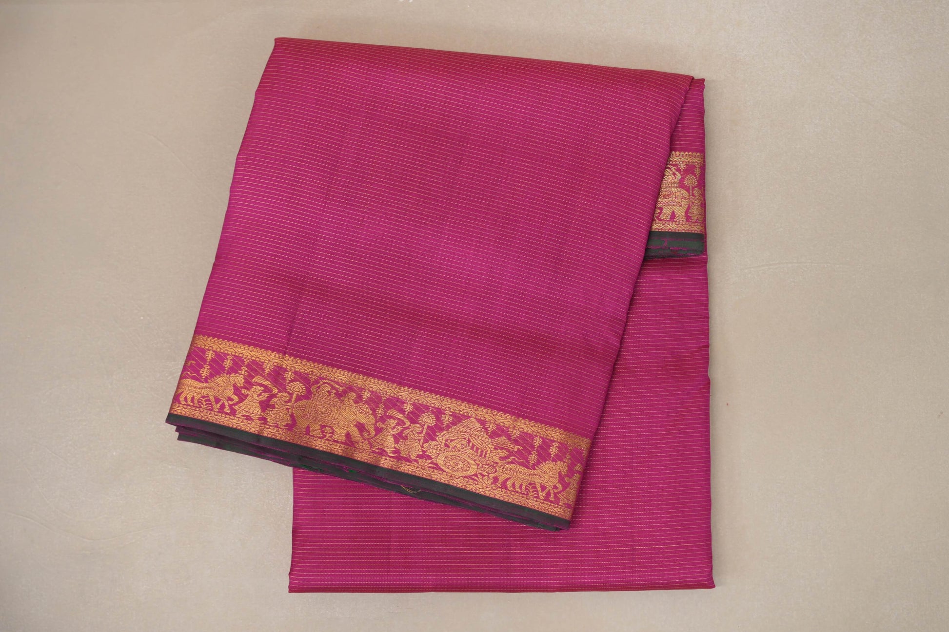 folded Rani Pink Ten Yards Silk Saree