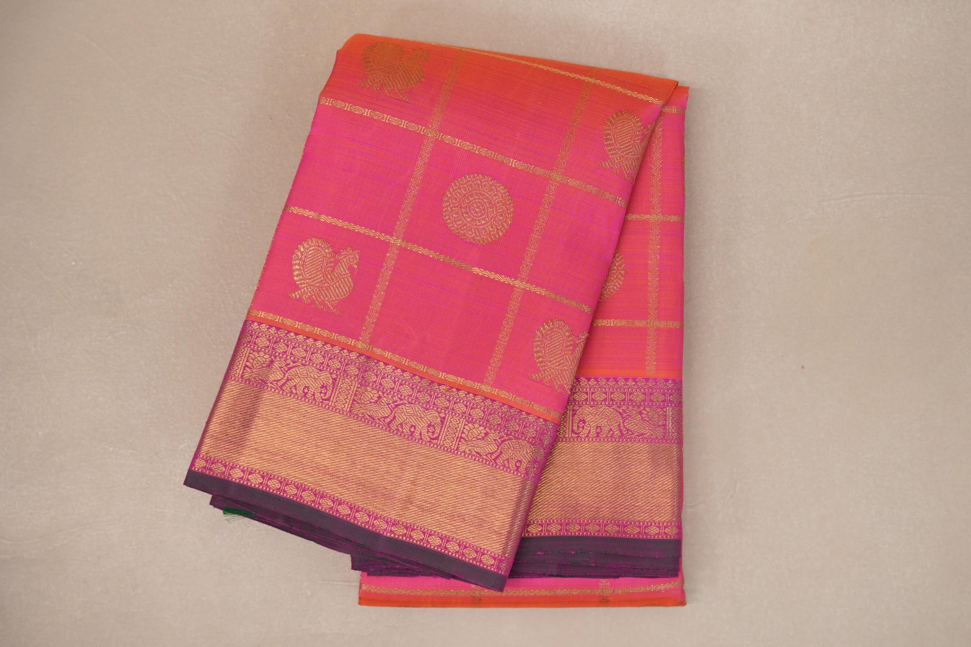 Orangish Pink with Bright Magenta Borders Heirloom Kanjivaram Silk Saree folded 