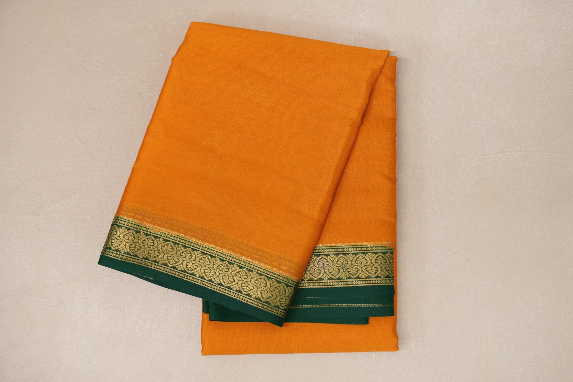 folded Bright Mango Yellow Mysore Silk Saree
