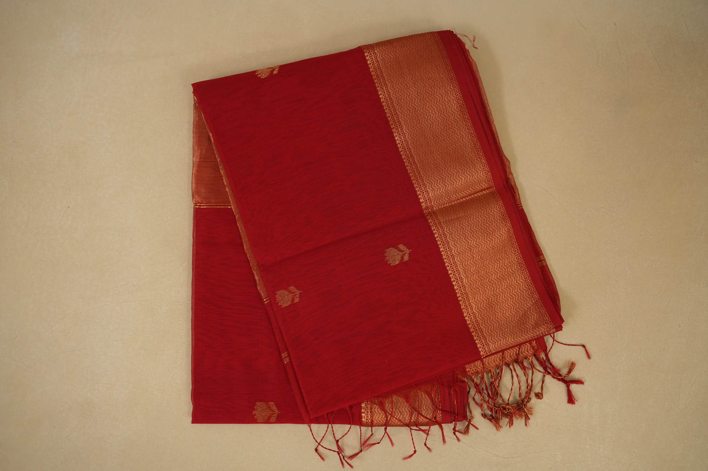 folded Red Maheshwari Silk Cotton Saree 