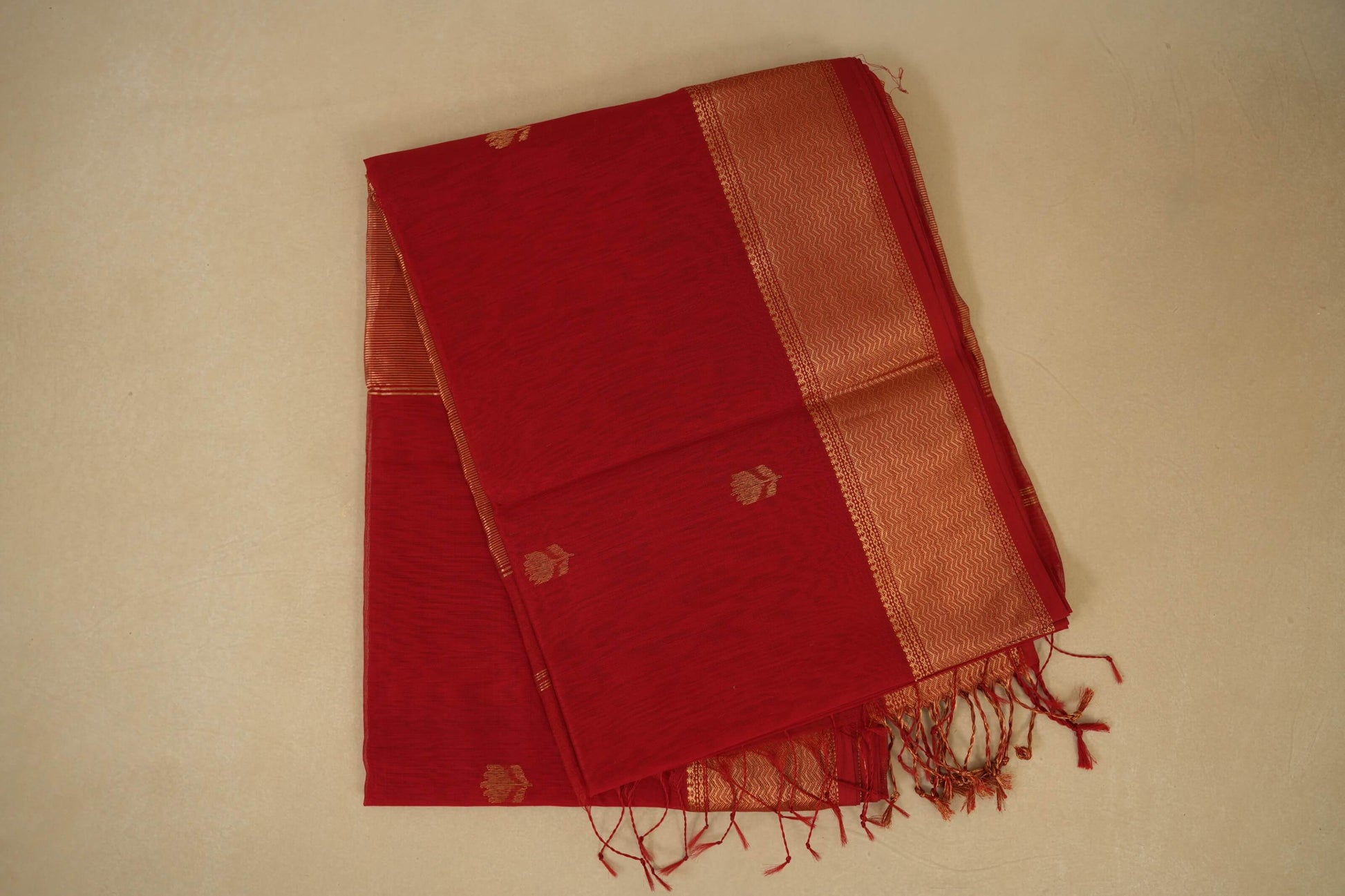 folded Red Maheshwari Silk Cotton Saree 