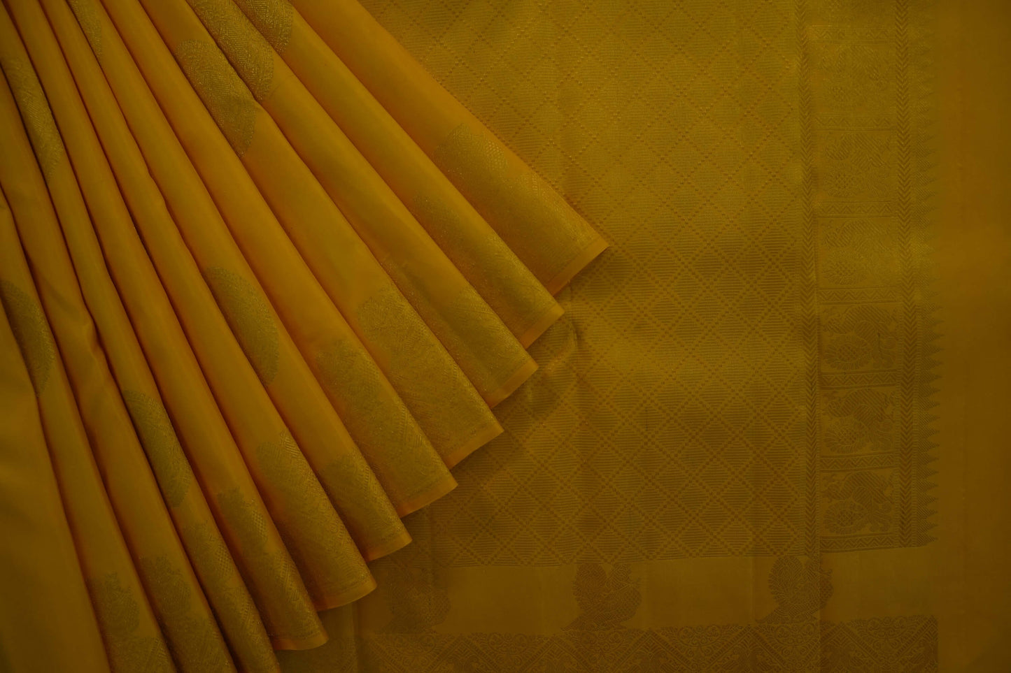Bright yellow kanchipuram silk saree