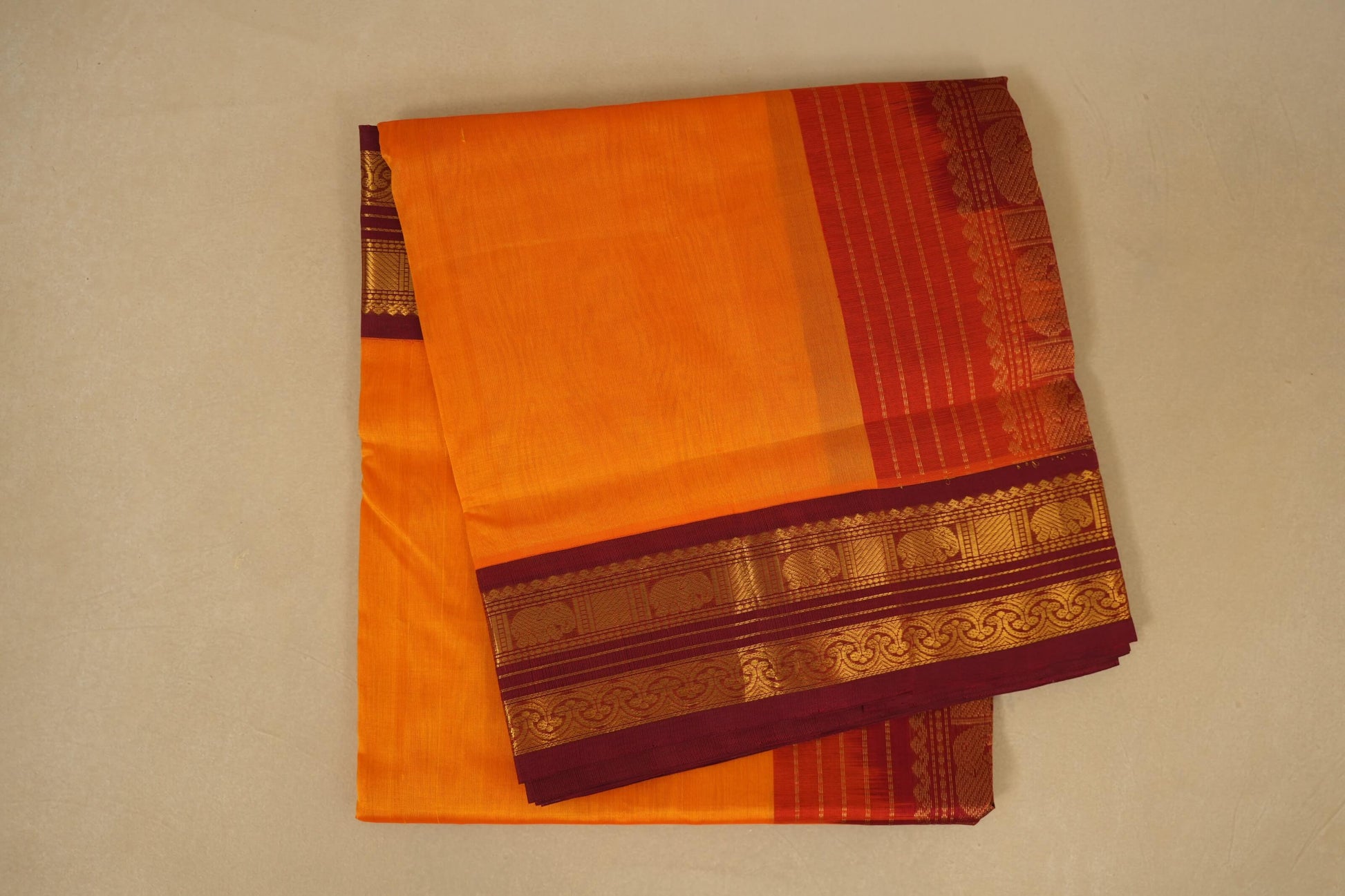folded Orange with Dark Maroon Borders Silk Cotton Saree 