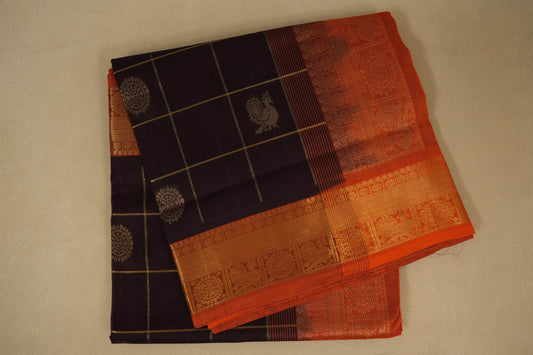 Deep coffee brown and orange saree with intricate patterns on a beige background, silk cotton , nine and a half yards saree, folded