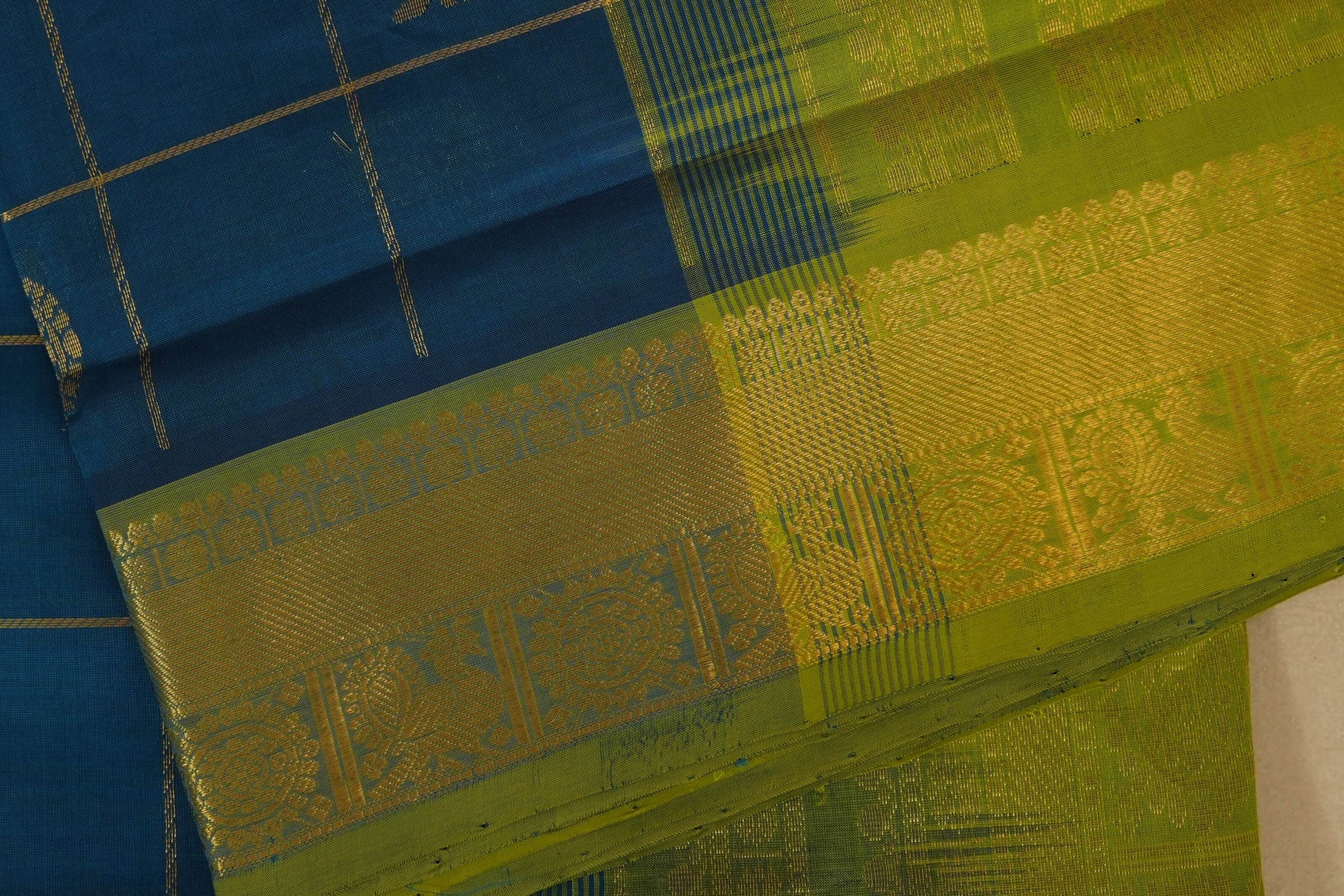 Blue and green saree with intricate patterns