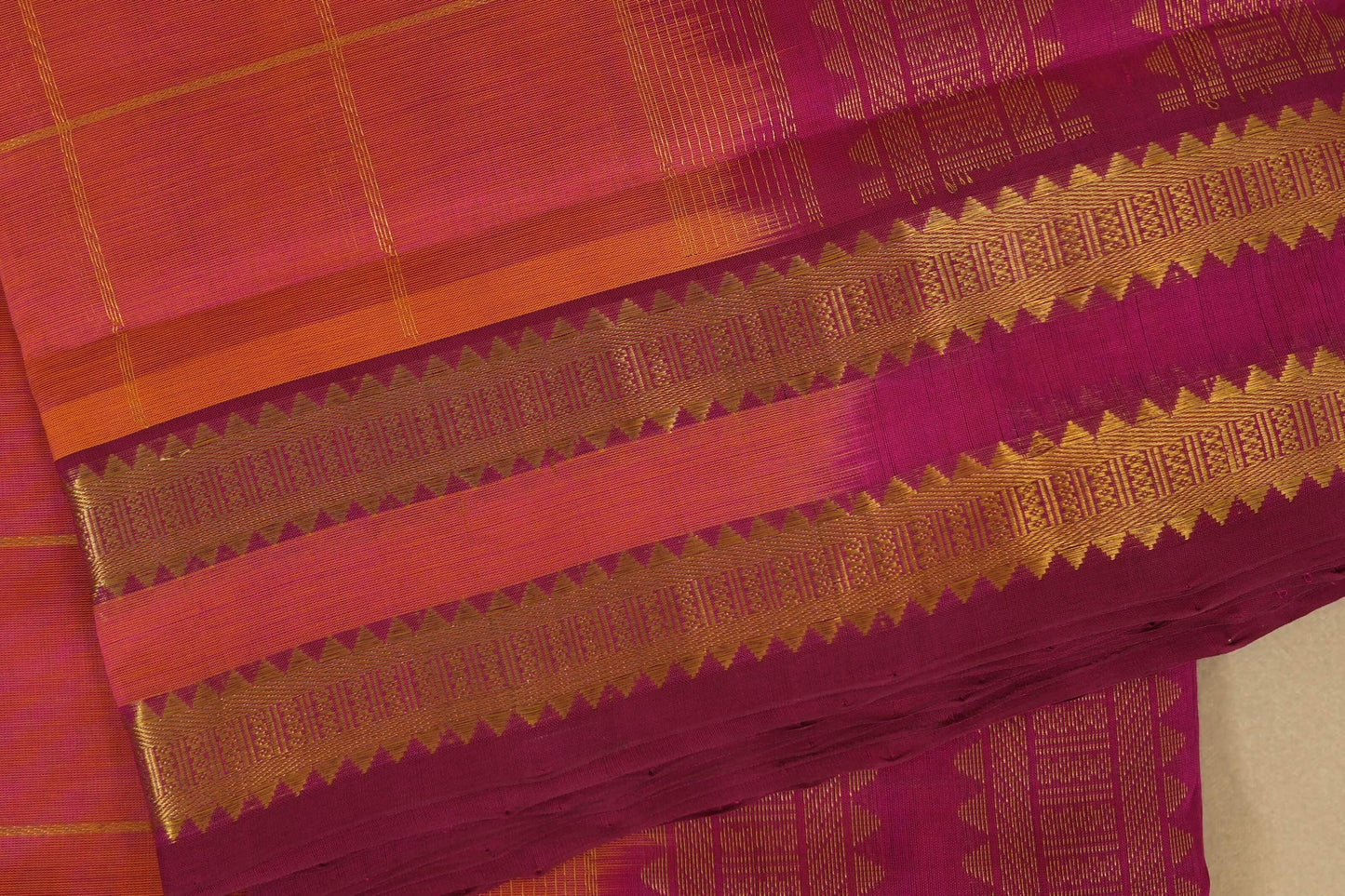 Close-up of a pink saree with gold border,  silk cotton , nine and a half yards saree, close up