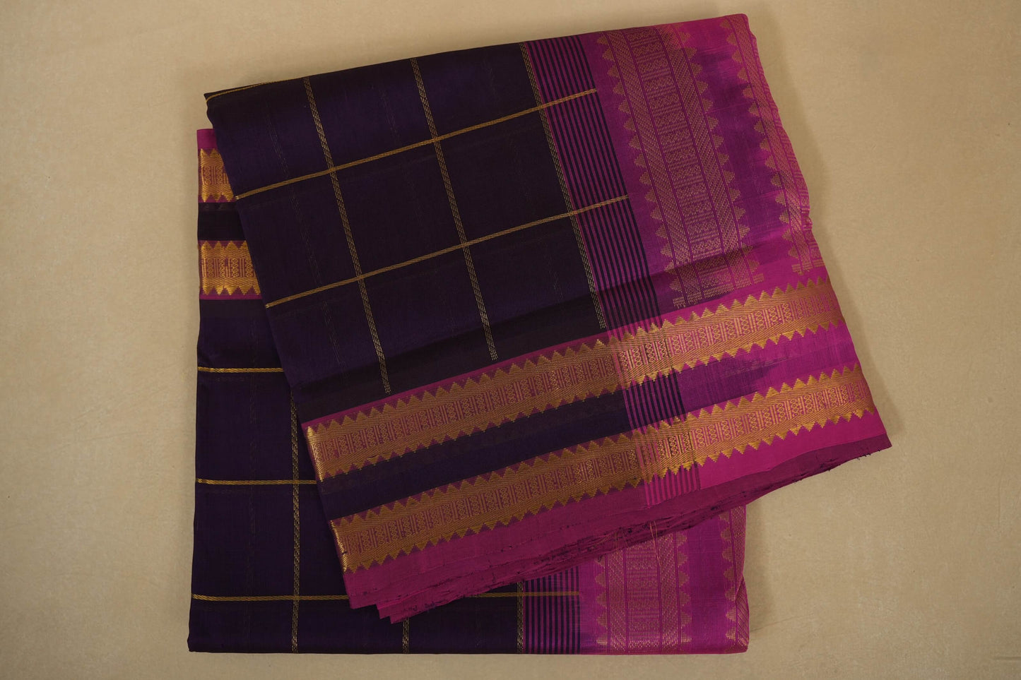 Purple and pink traditional fabric with checkered pattern, silk cotton , nine and a half yards saree, folded