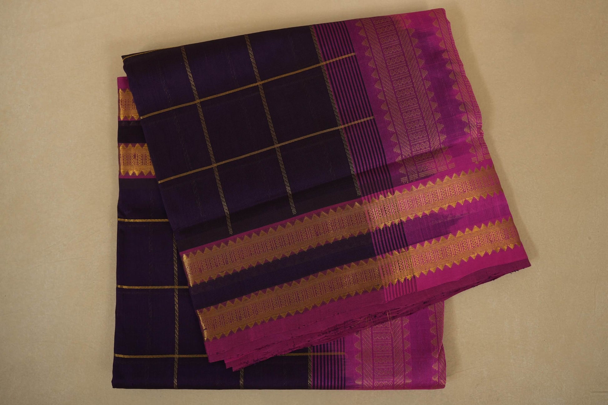 Purple and pink traditional fabric with checkered pattern, silk cotton , nine and a half yards saree, folded