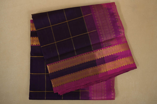 Purple and pink traditional fabric with checkered pattern, silk cotton , nine and a half yards saree, folded