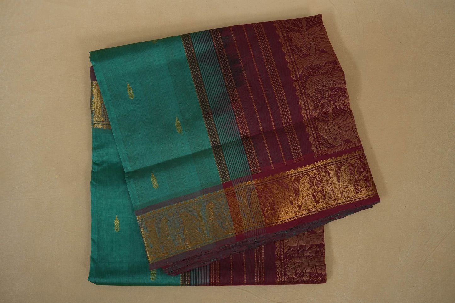 Teal and maroon saree with gold motifs, silk cotton , nine and a half yards saree , folded