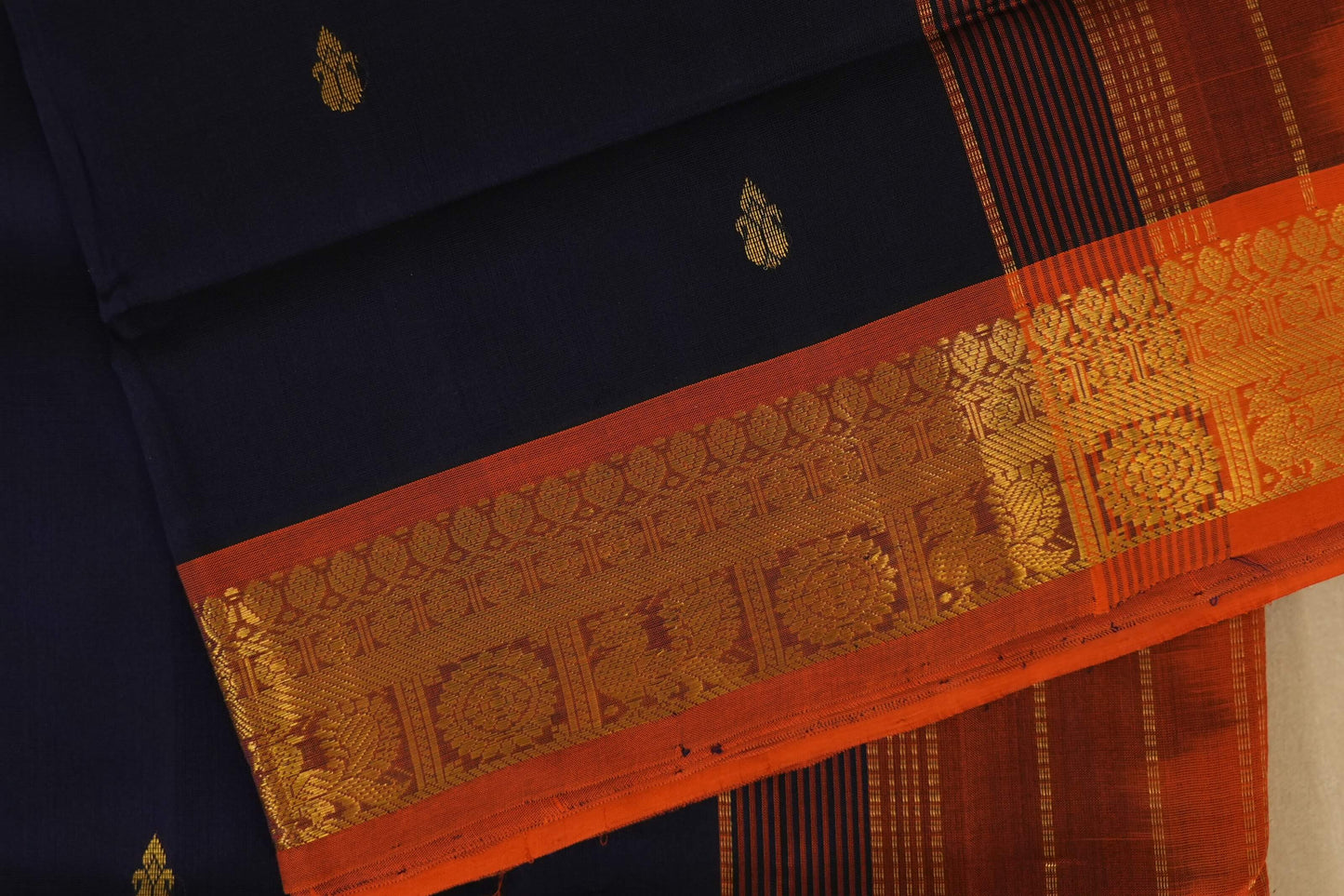 Traditional saree orange borders and gold accents, silk cotton , nine and a half yards saree close up