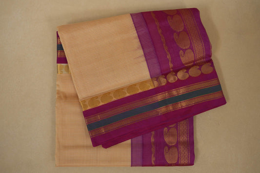 Folded beige saree with a purple border, silk cotton , nine and a half yards saree folded