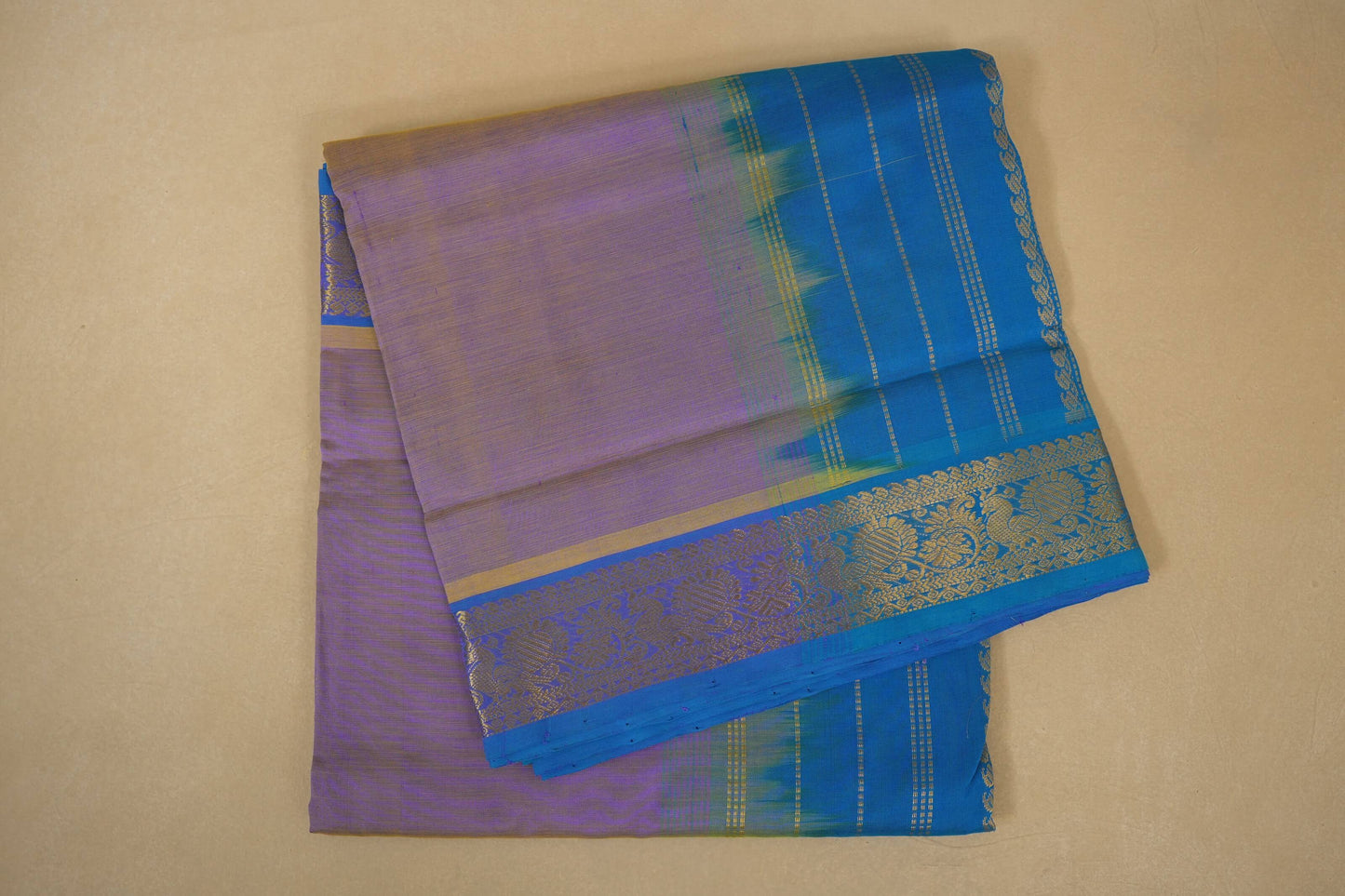 Purple and blue saree with a decorative border  , silk cotton , nine and a half yards saree folded 