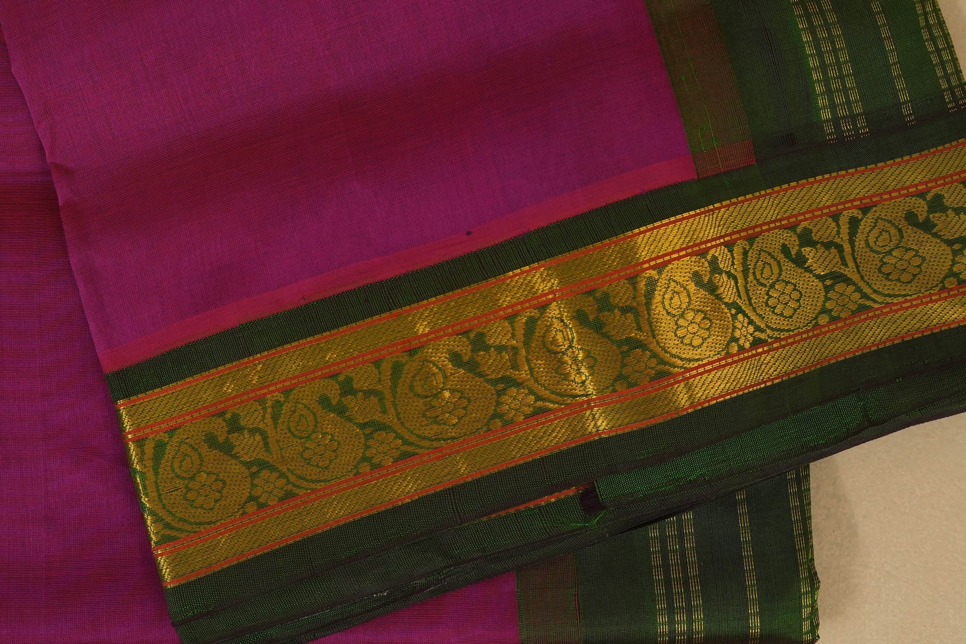 Pink saree with green and gold border , silk cotton , nine and a half yards saree close up