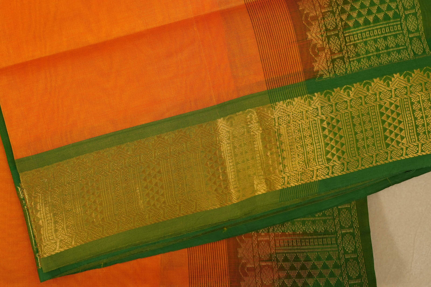 Orange and green traditional saree with intricate patterns, silk cotton , nine and a half yards saree