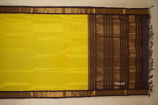 Yellow saree with a brown border with paloo, silk cotton , nine and a half yards saree