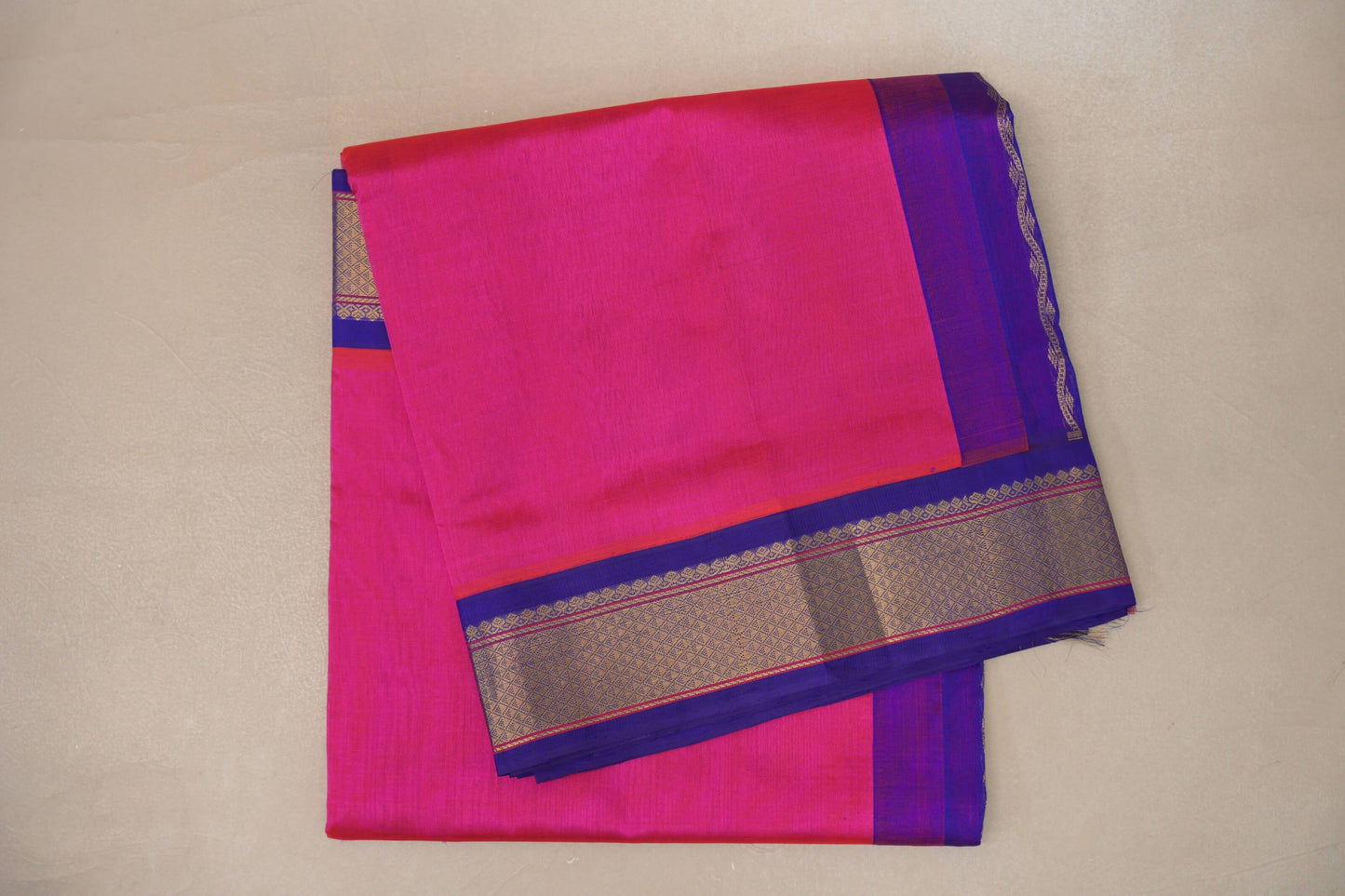 folded orangish pink Vintage Silk Cotton Saree 