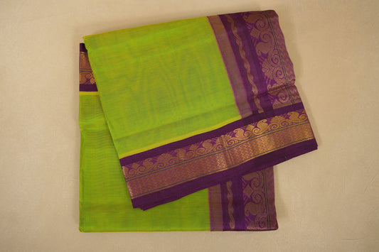 Green saree with purple border on a beige background, silk cotton , nine and a half yards saree