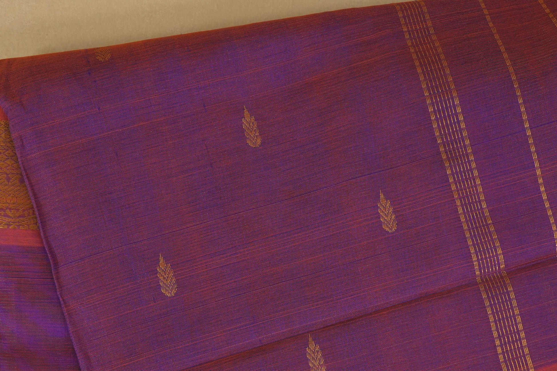 Purple silk cotton saree with gold leaf patterns close up