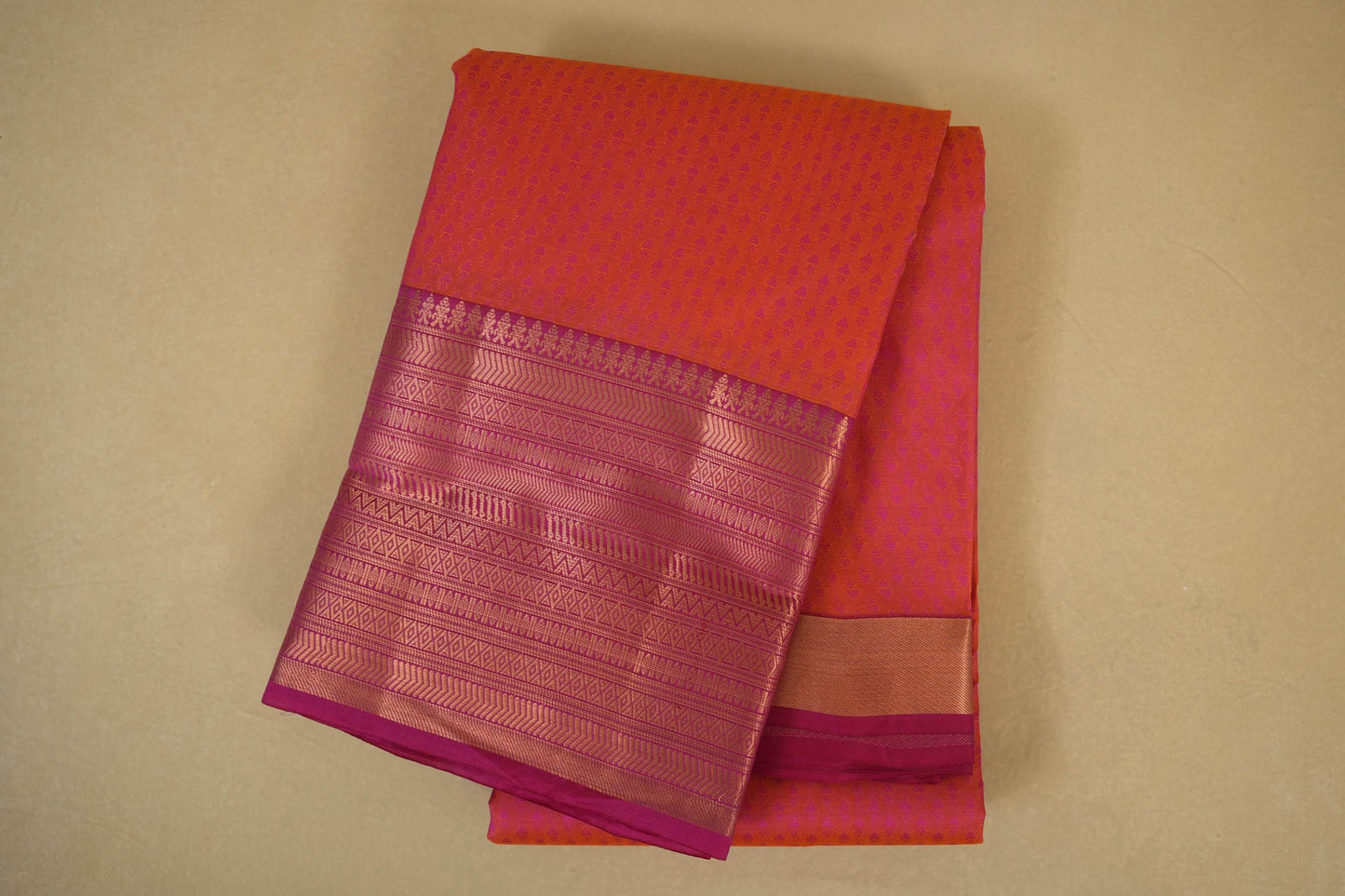 Folded Pinkish Orange with Pink Borders Light Weight Kanchipuram Silk Saree 