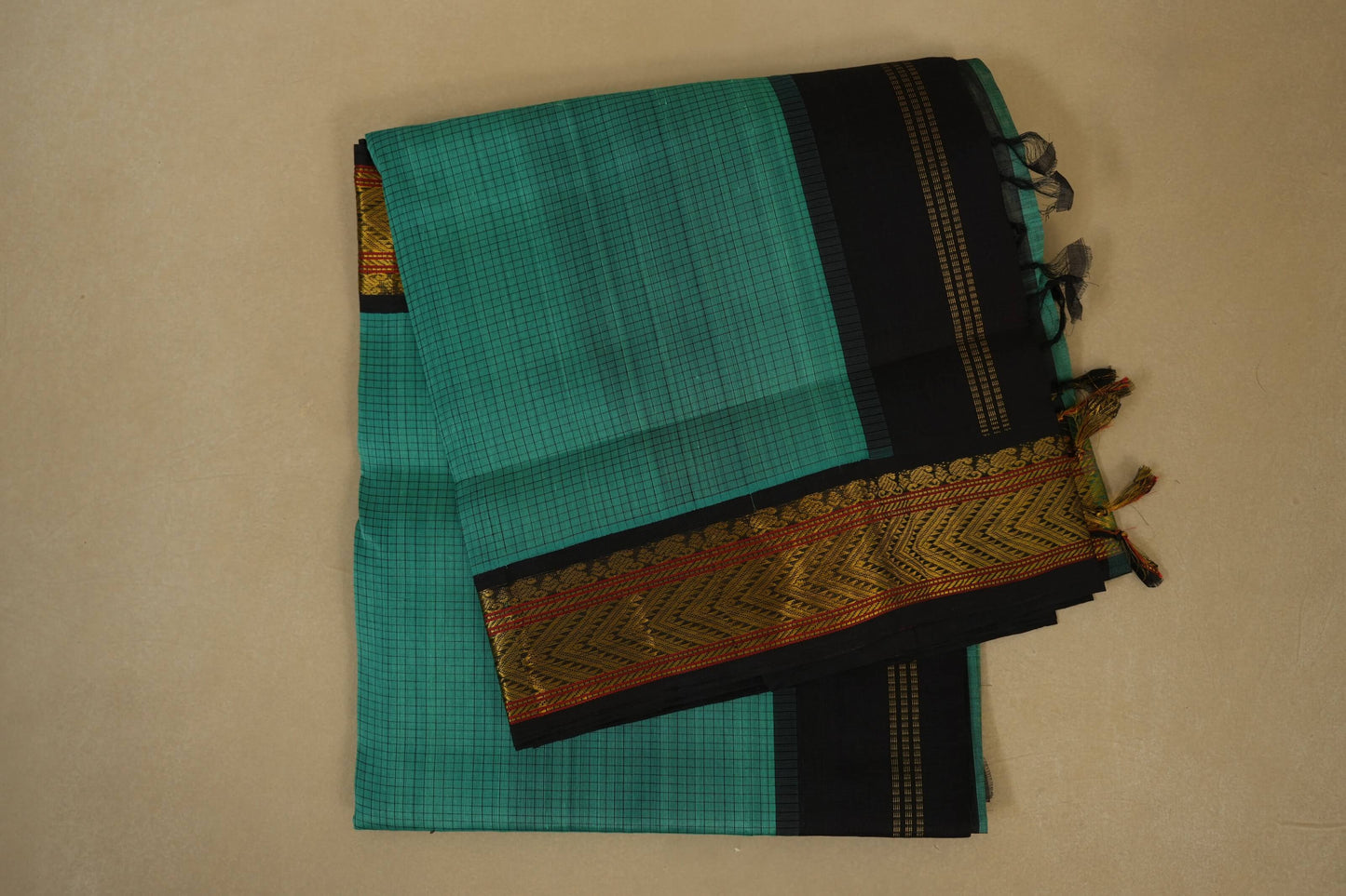 Folded Rexona Green with Deep Brown Borders Silk Cotton Saree