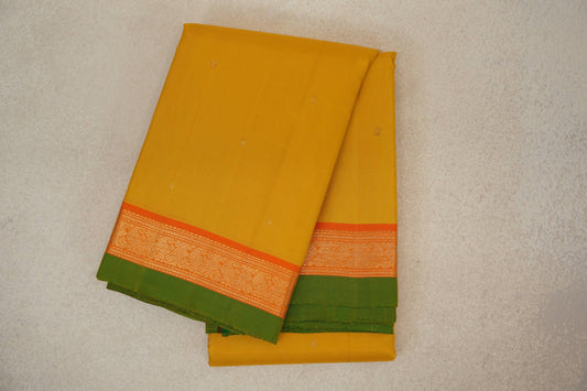 Turmeric Yellow with Bright Orange Borders with Leaf Green Selvedge Vintage Kanjivaram Silk Saree by Shreenivas Silks