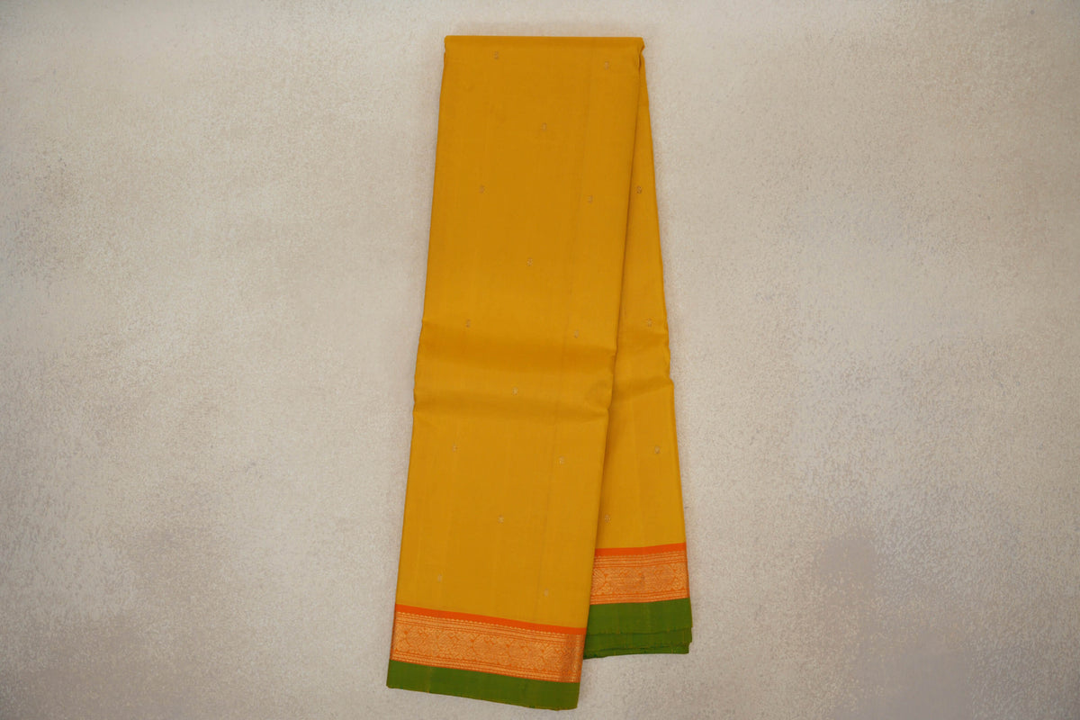 Turmeric Yellow with Bright Orange Borders with Leaf Green Selvedge Vintage Kanjivaram Silk Saree by Shreenivas Silks