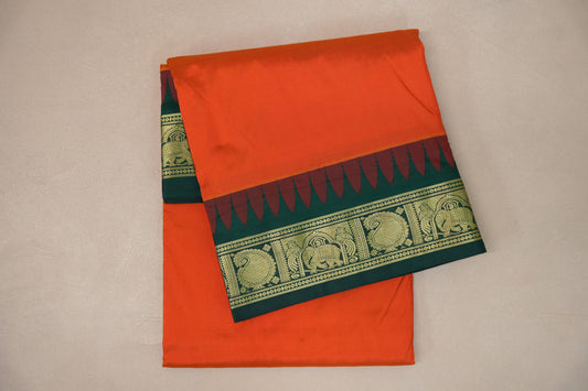 folded Reddish Orange  Ten Yards Silk Cotton saree 
