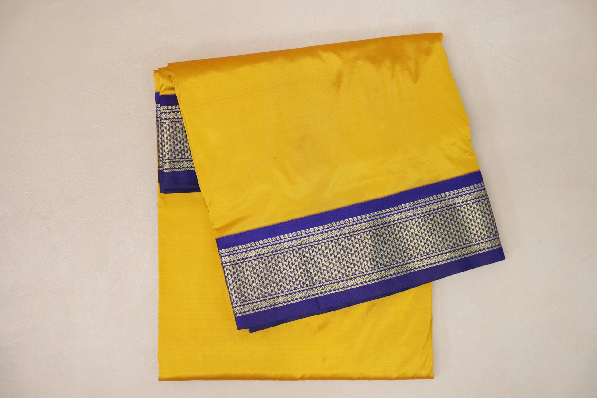 folded Bright yellow Ten Yards Silk Cotton saree 