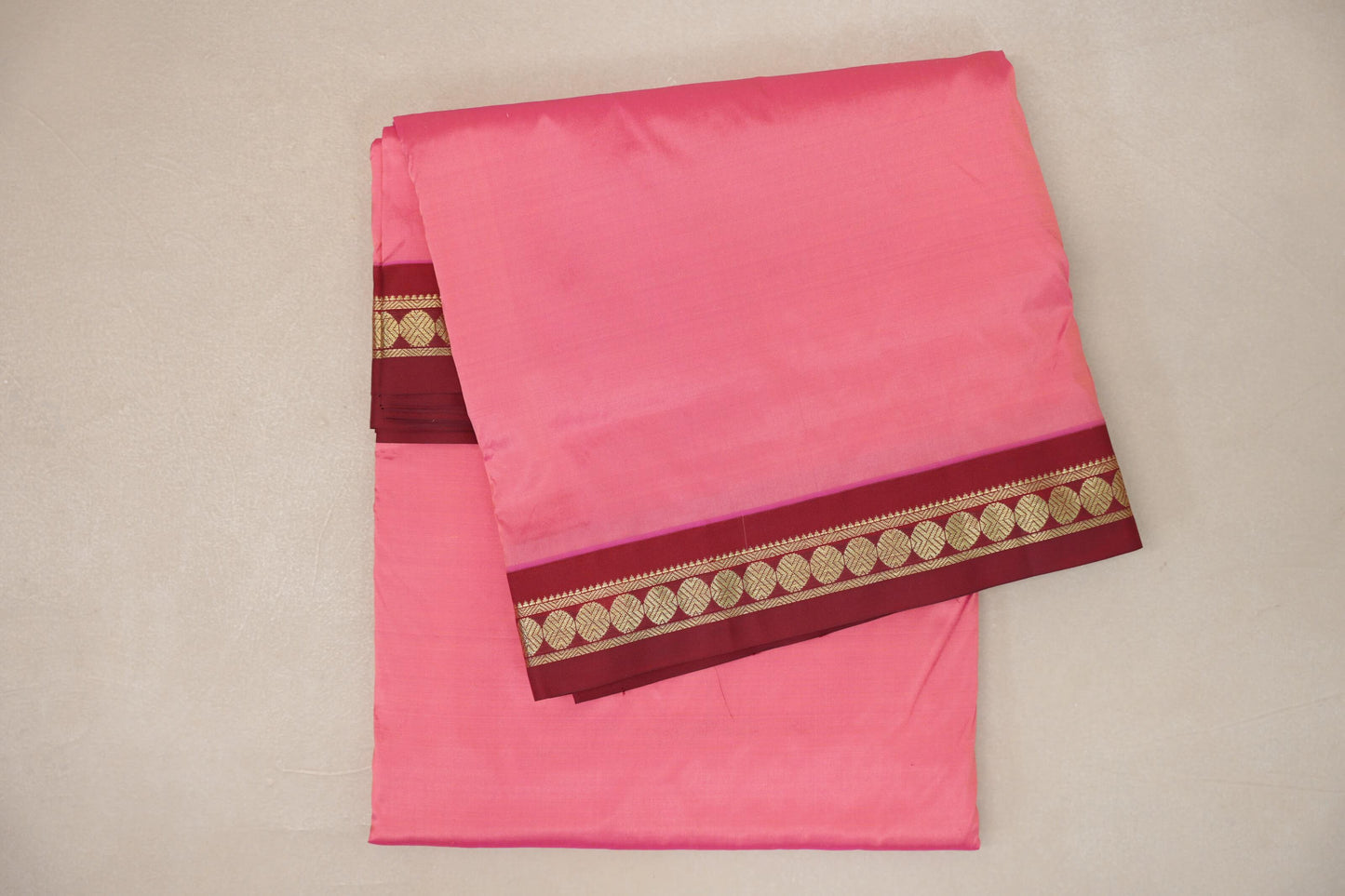 folded light rani pink Ten Yards Silk Saree 