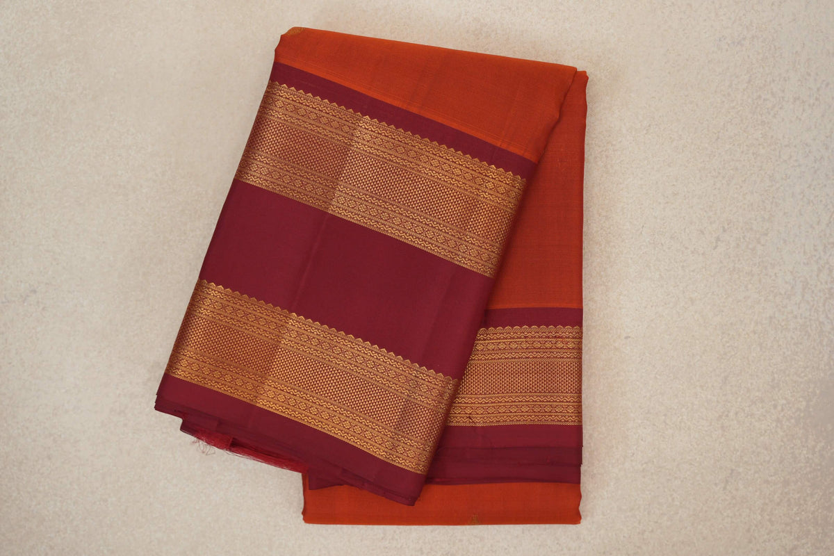 folded Rust Orange Light Weight Kanchipuram Silk Saree