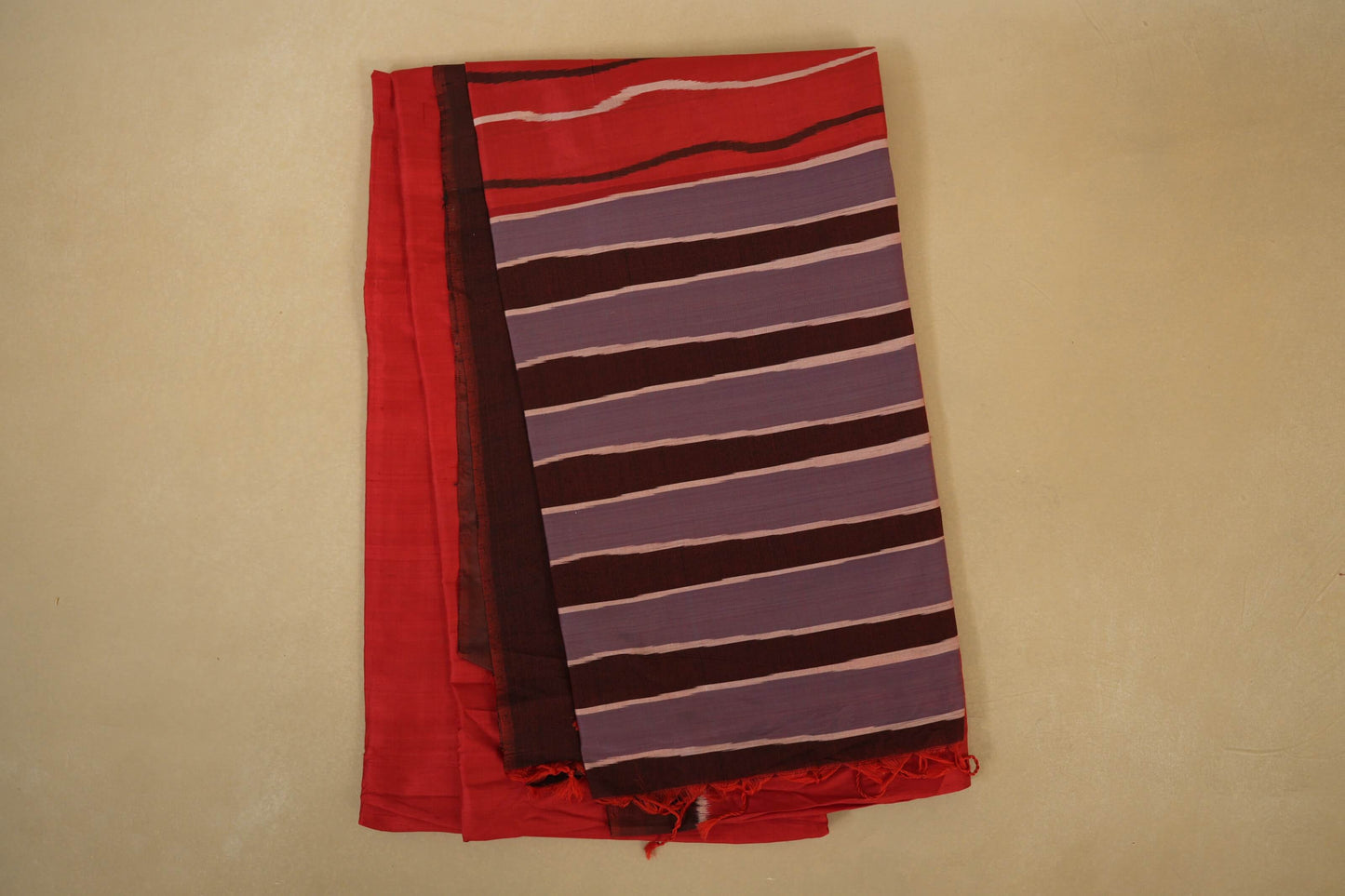 Folded Reddish Orange with Coffee Brown Borders Ikat Silk Saree