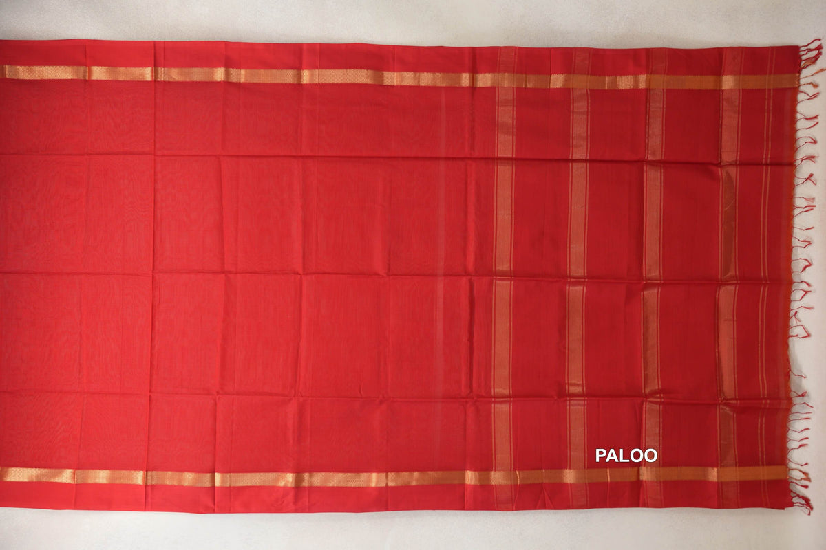 Vermilion Red Maheshwari silk cotton saree spread flat, showing the pallu with gold-toned stripes, matching borders and red tassels.