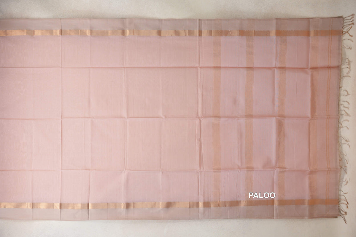 Blush pink Maheshwari silk cotton saree pallu laid flat, with light sandal beige borders, vertical stripes and tassels at one end.