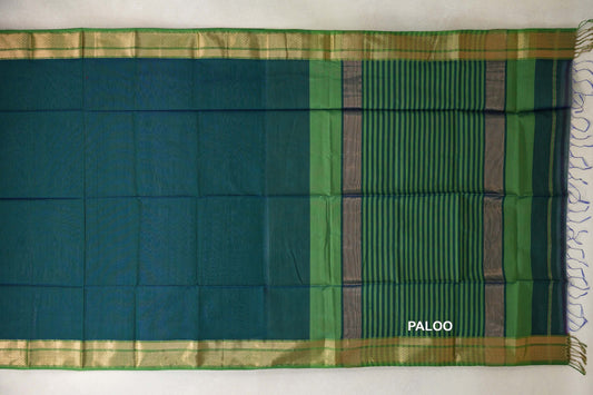 Maheshwari silk cotton saree laid flat, with a plain peacock blue body, leaf green borders and a blue and green striped pallu with tassels.