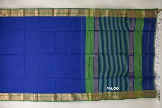 Maheshwari silk cotton saree spread flat, with a bright royal blue body, leaf green borders and a blue-and-green striped pallu.