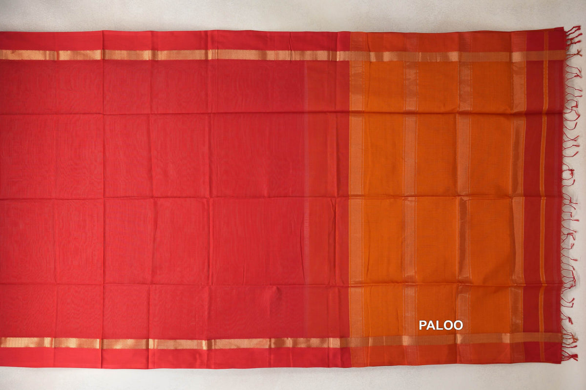 Maheshwari silk cotton saree spread flat, with a plain vermilion red body, narrow gold-coloured border stripes and a deep orange pallu with tassels.
