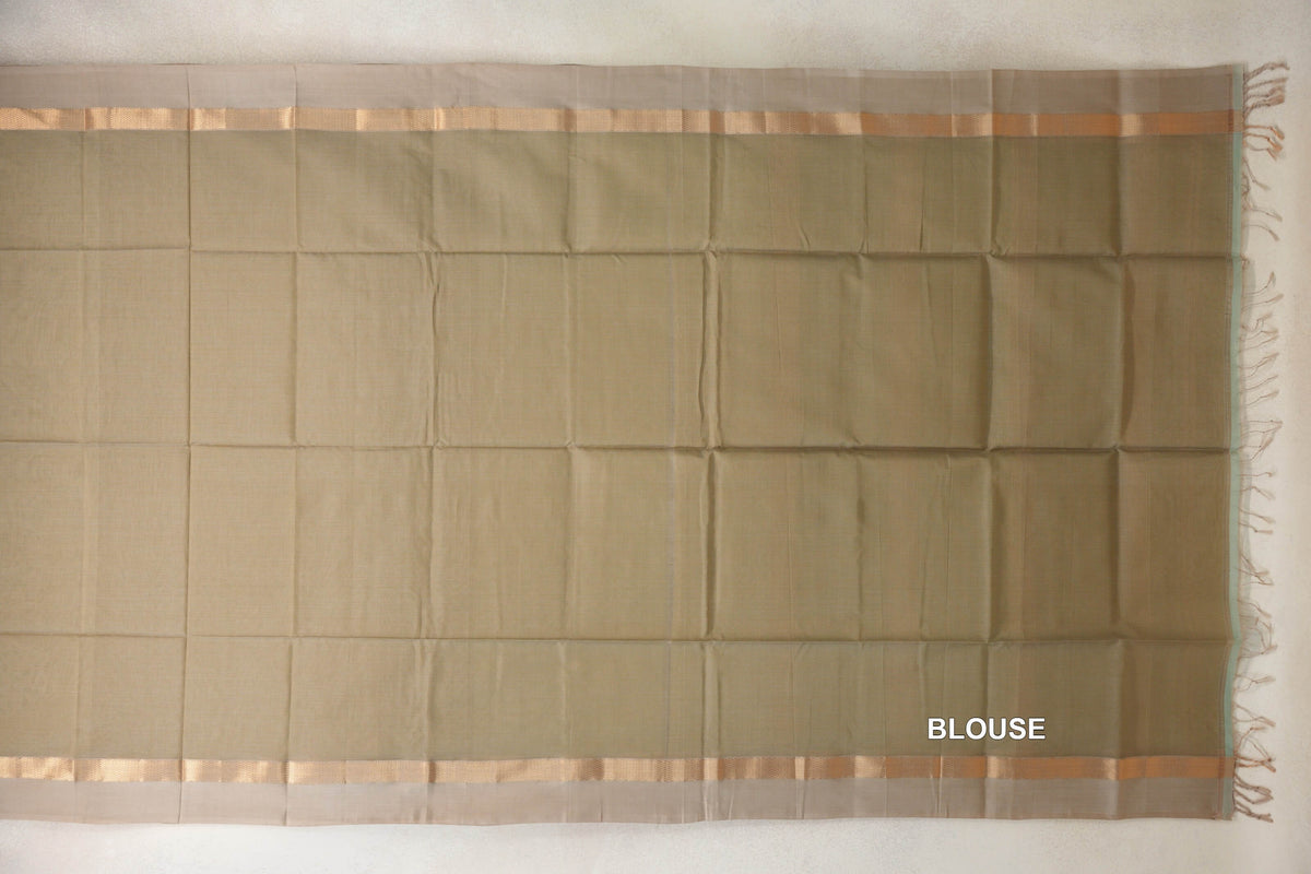 Light olive green Maheshwari silk cotton blouse piece laid flat, with light beige borders, narrow patterned stripes and tassels along one edge.