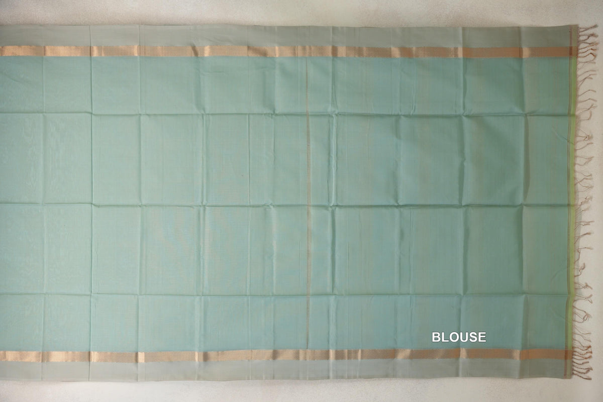 Sea green Maheshwari silk cotton blouse piece laid flat, with light sandal beige woven borders along the top and bottom and fringe at one end.