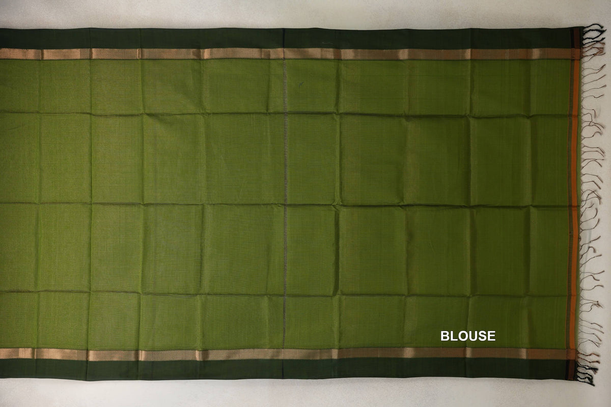 Olive green Maheshwari silk cotton blouse piece laid flat, with deep forest green borders, narrow gold-toned stripes and tassels at one end.