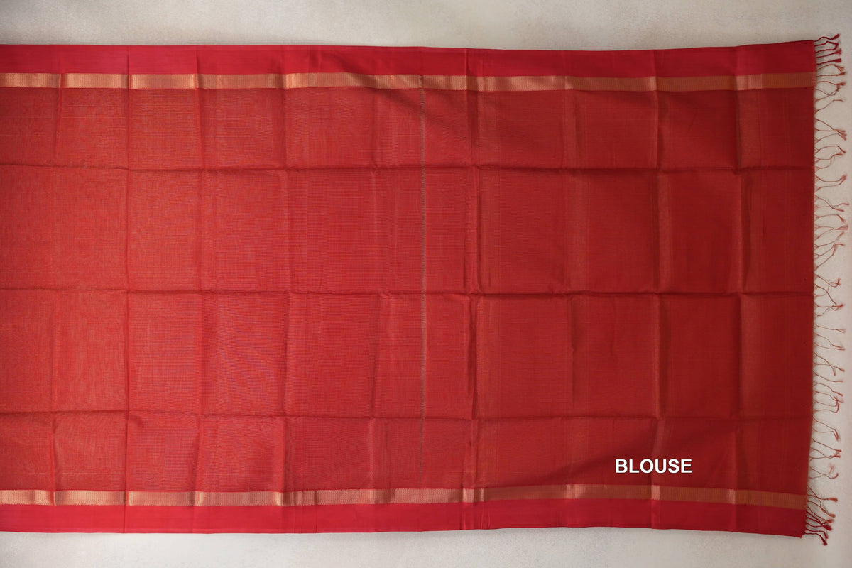 Red Maheshwari silk cotton blouse piece laid flat, with narrow metallic-toned border stripes and tassels along one edge.