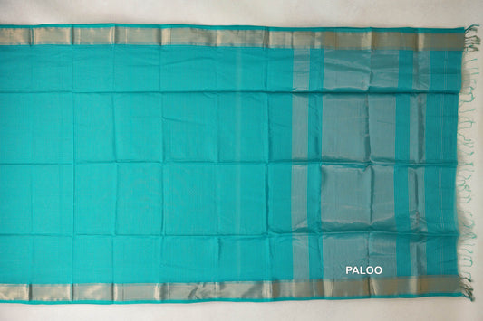 Turquoise Green Maheshwari silk cotton saree spread flat, with a finely checked body, silvery borders and a striped pallu with fringe.