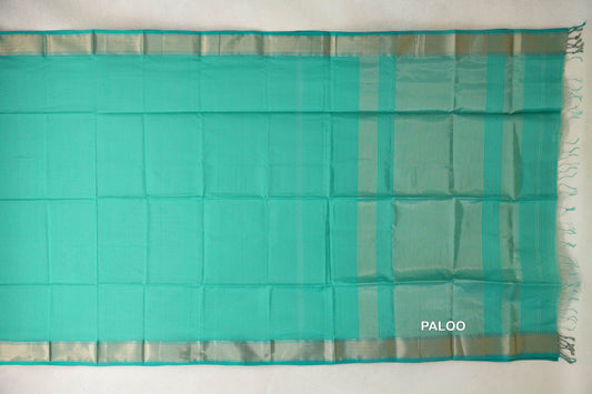 Turquoise green Maheshwari silk cotton saree laid flat, showing a plain body, striped pallu, pale silver-toned borders and end tassels.