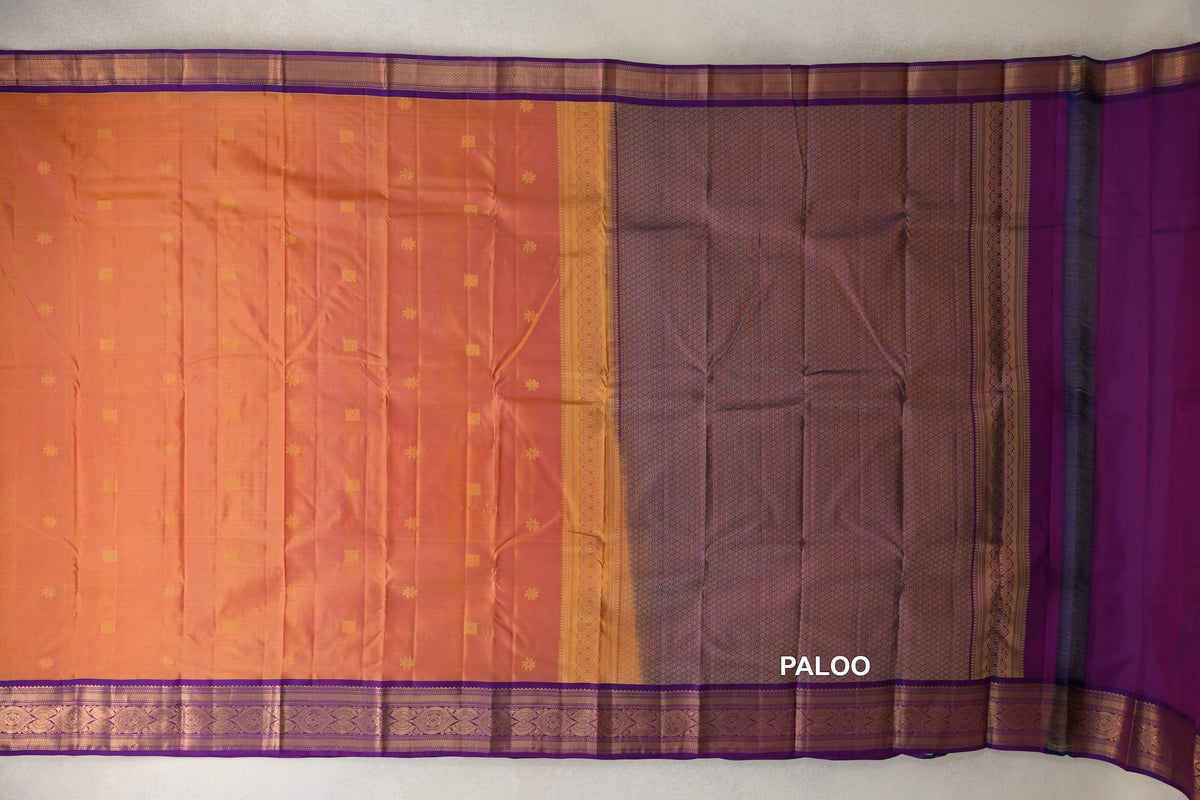 Spread-out Light Weight Kanchipuram silk saree with a pink and yellow body, small gold motifs, deep purple patterned pallu and ornate borders.